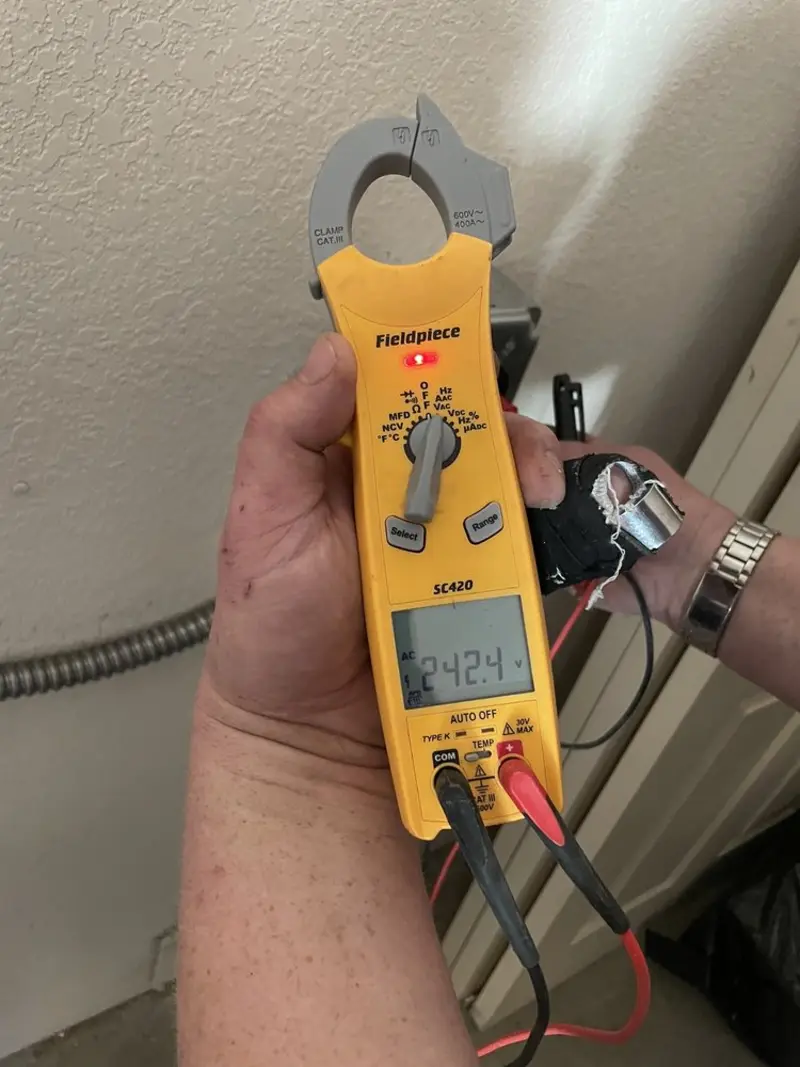 Voltage testing with clamp meter during Aluminum Wiring Replacement in Webster City